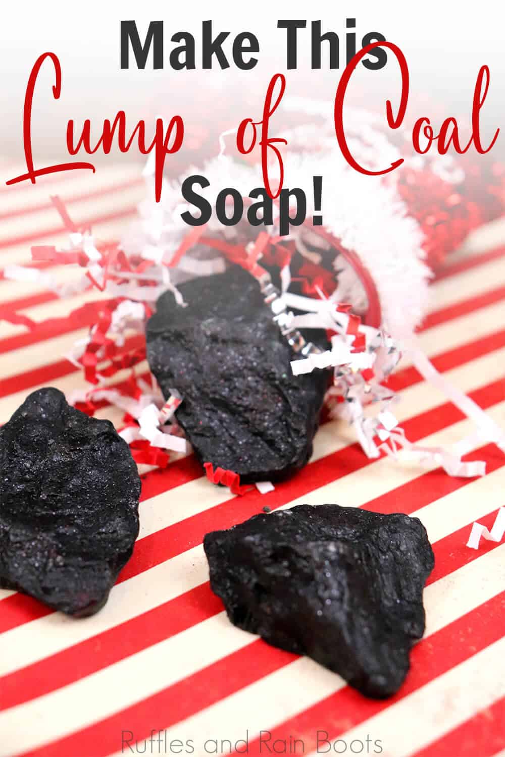 side view of coal shaped soap for a christmas gift on a red and white striped background with text which reads make this lump of coal soap
