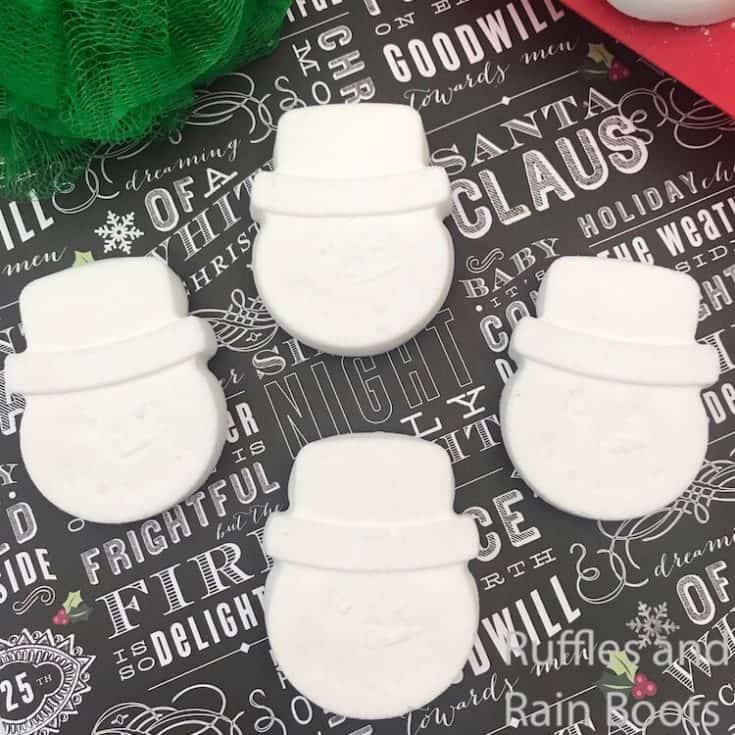 snow man bath bomb recipe on dark wrapping paper