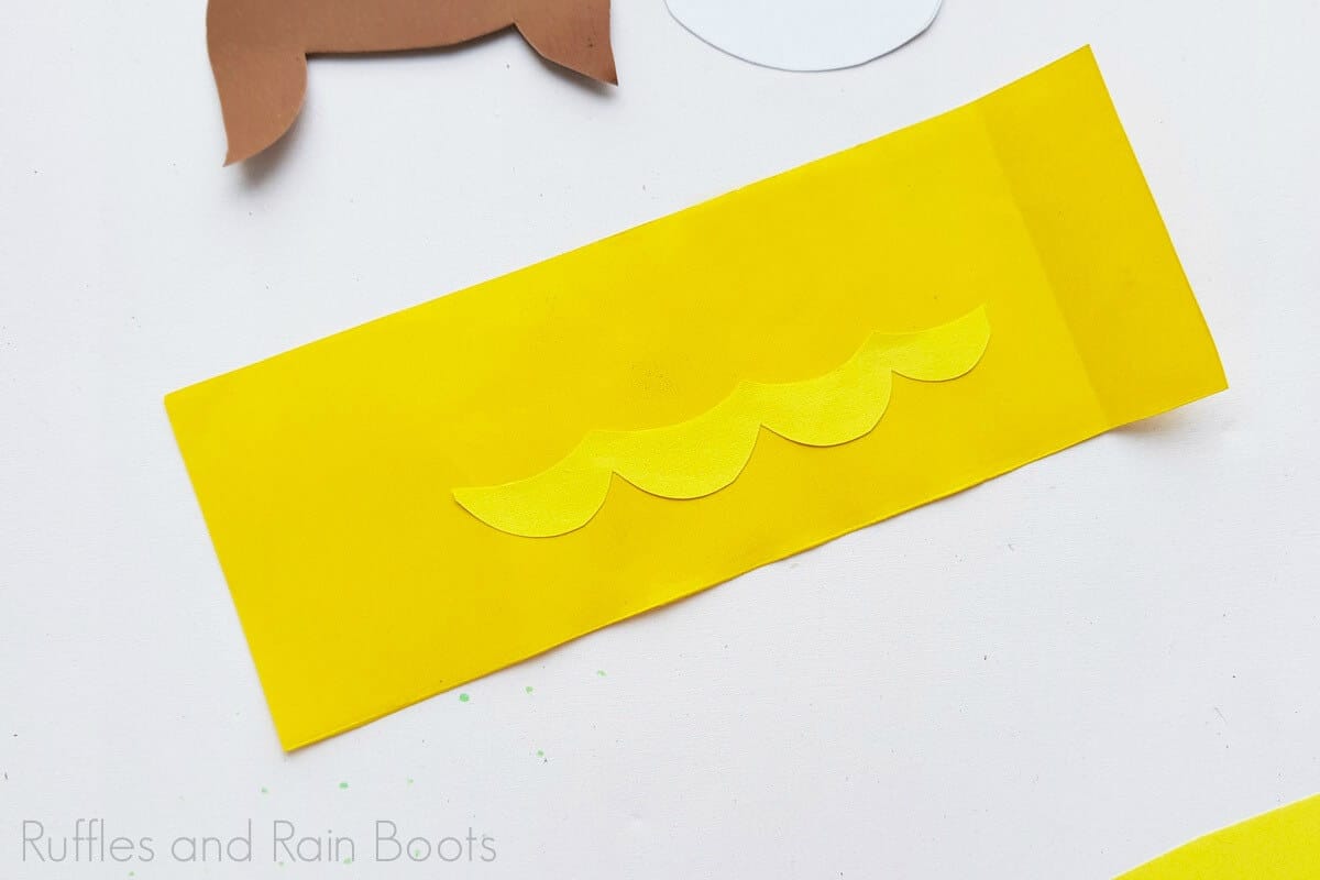 A second Image of the cutouts with the dress being put together for Princess Belle on a white background.