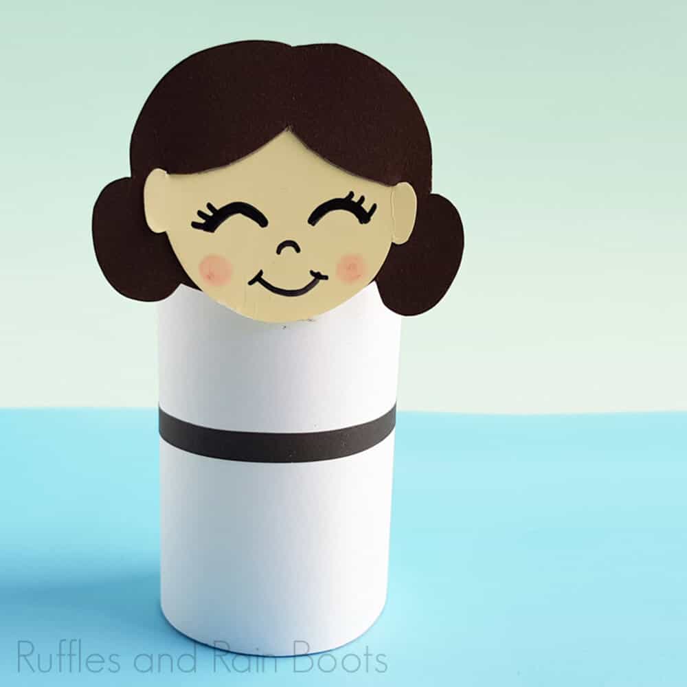 Square Image of Princess Leia Paper craft on light blue and light green background.