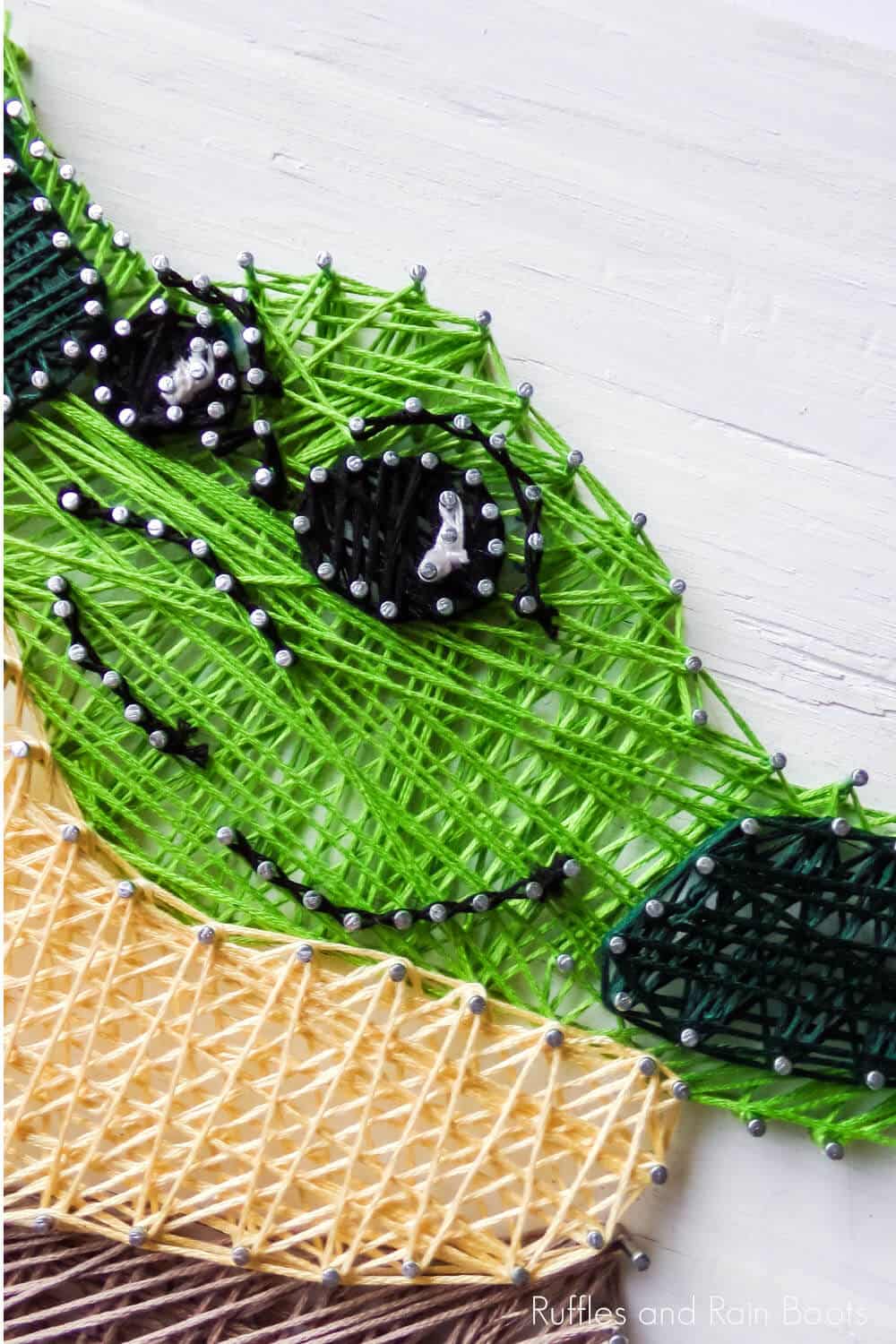 closeup of easy baby yoda string art project