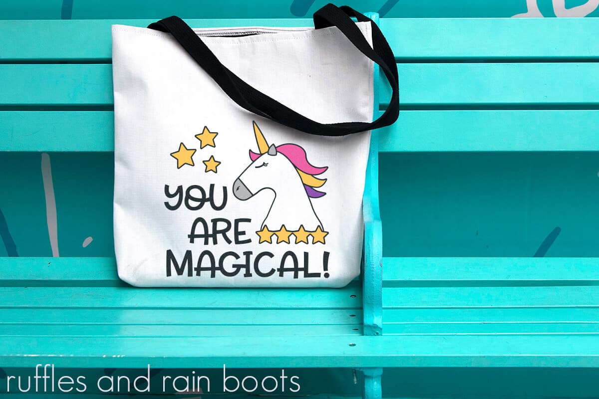 Unicorn SVG for Girl Vinyl Layering Magic on a canvas bag sitting on a bright bench