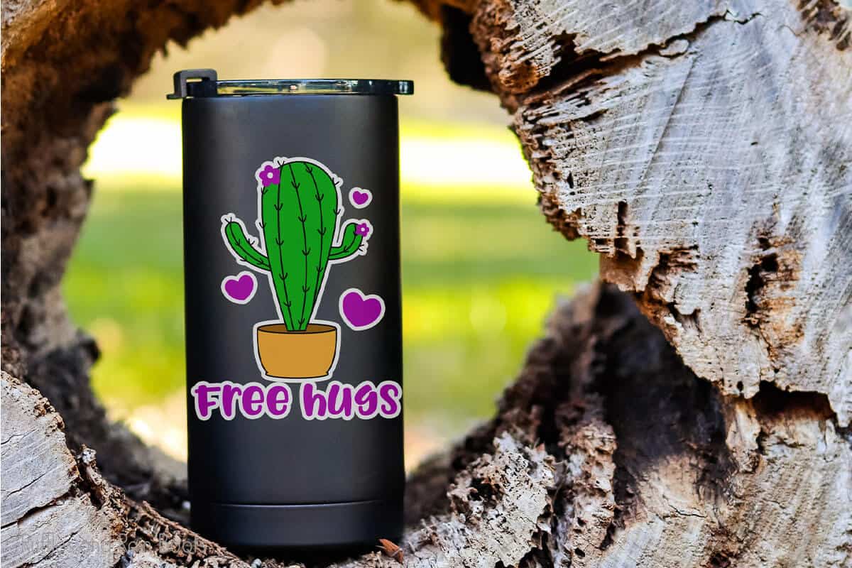 black tumbler with the free hugs cactus cut file on it 