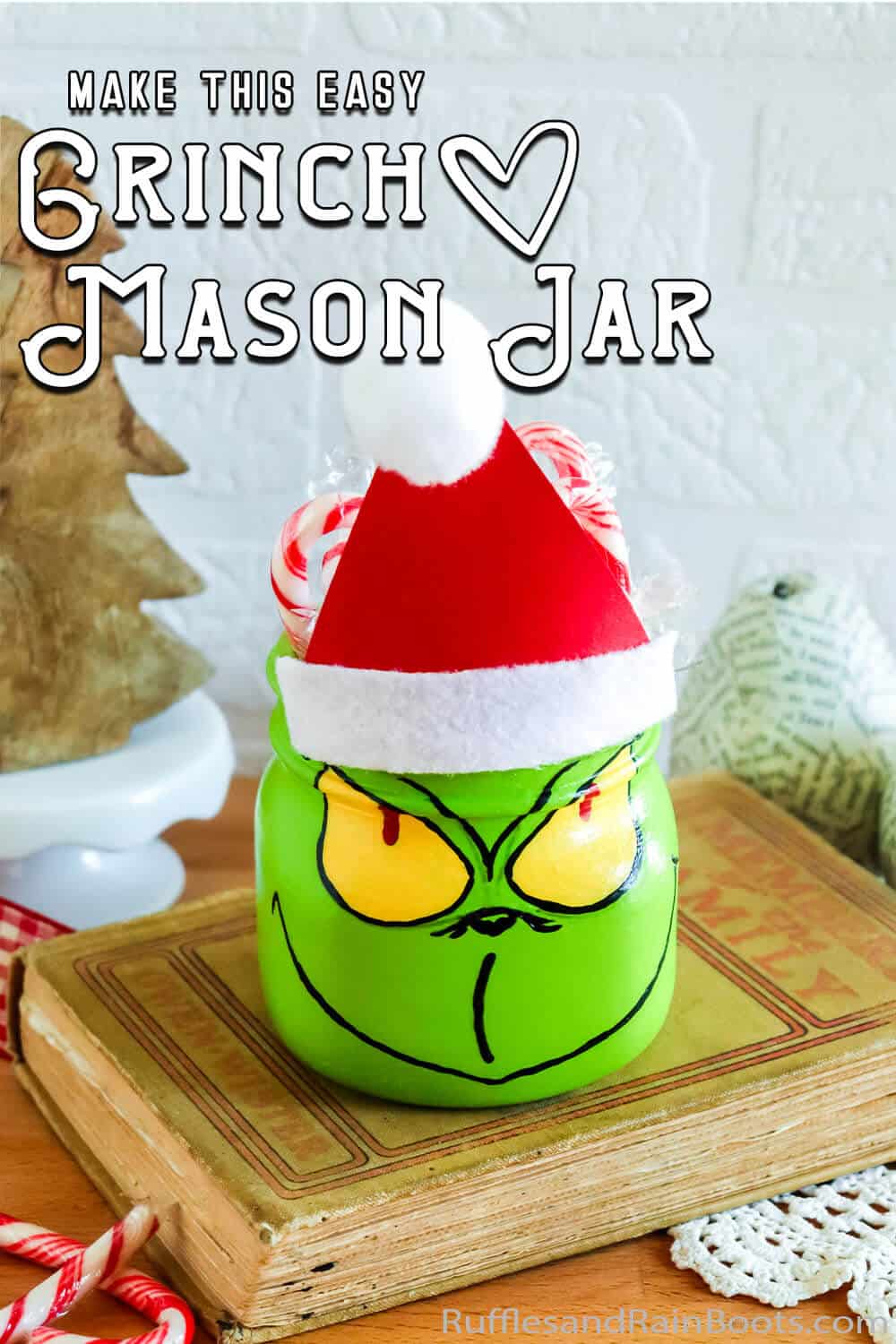 easy painted mason jar craft for a gift with text which reads make this easy grinch mason jar