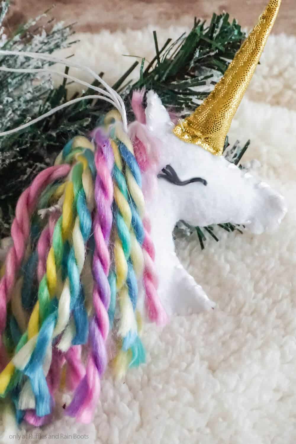 closeup of fun DIY holiday ornament unicorn felt ornament