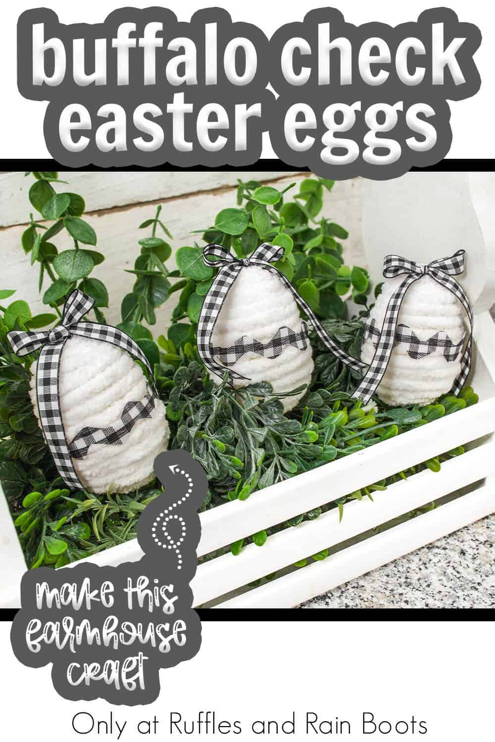 Three farmhouse Buffalo plaid easter eggs in a white wood toolbox with boxwood greenery and text which reads buffalo check easter eggs.