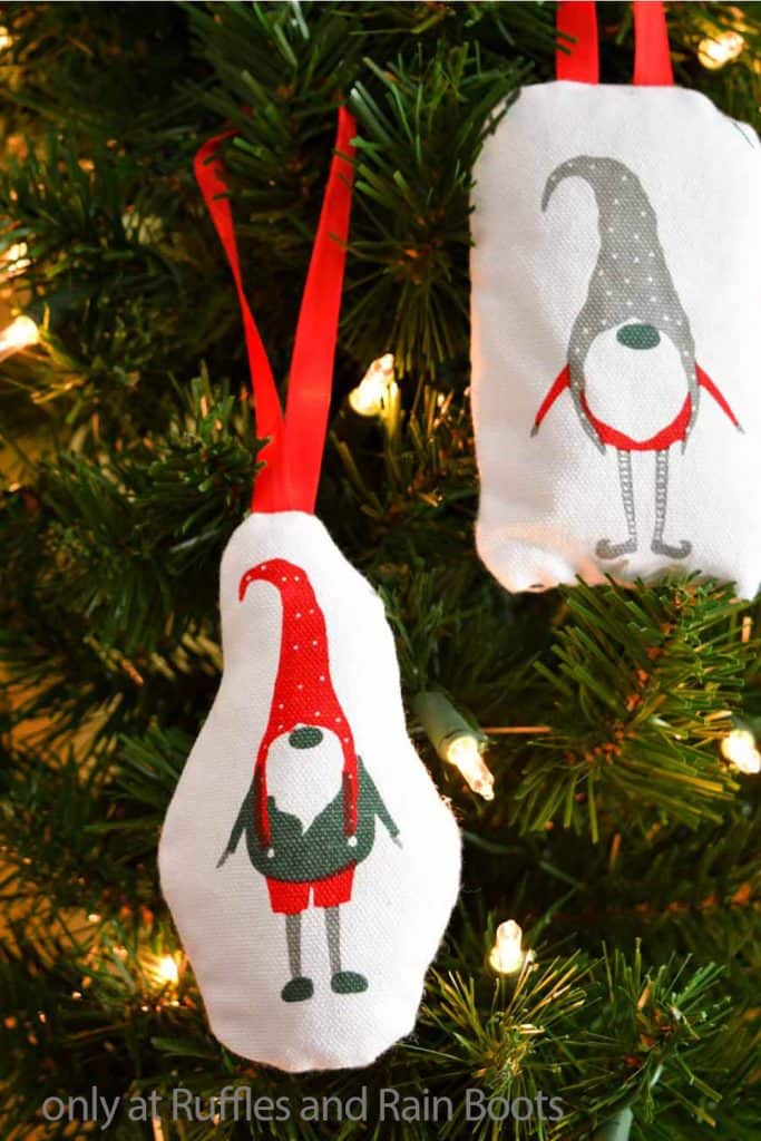 Christmas gnome ornament plush from a napkin hanging on a tree.