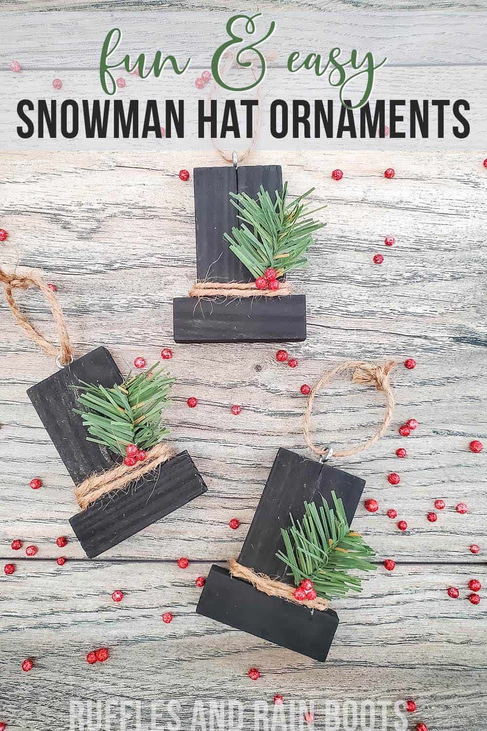 image of three black snowman hat ornaments made from tumbling tower blocks with text which reads fun and easy snowman hat ornaments ruffles and rain boots