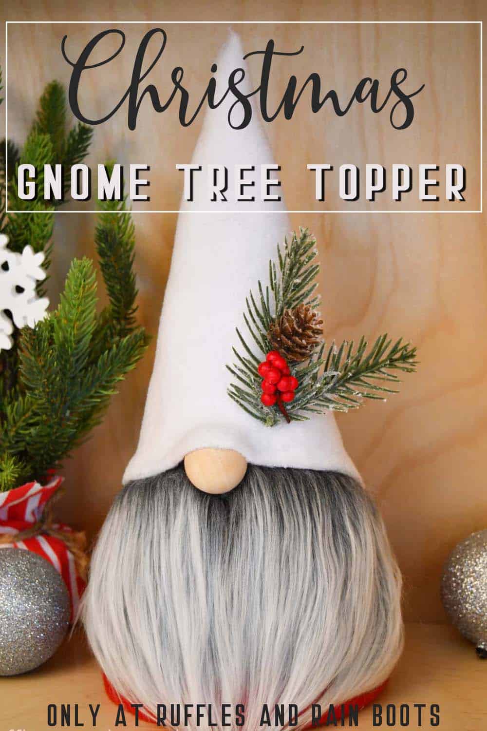 white hat on red gnome with gray beard and pine and berry accent in front of a holiday background with text which reads Christmas gnome tree topper only at ruffles and rain boots