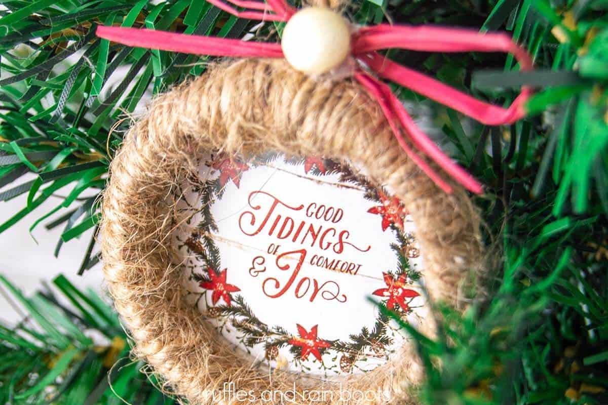 horizontal close up image of a Dollar Tree wreath ornament made with shower curtain rings and the Dollar Tree calendar