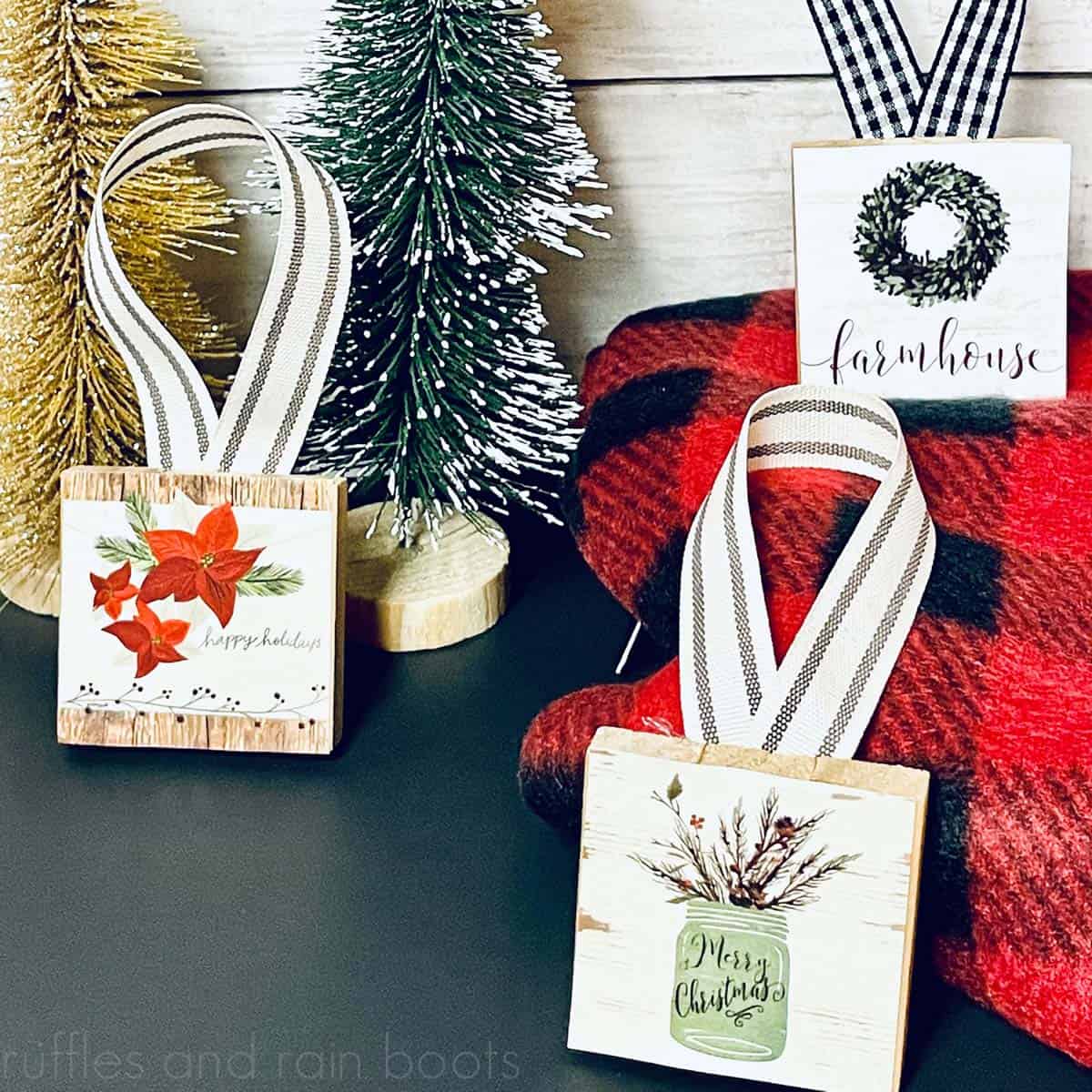 close up of Dollar Tree Christmas ornaments made using Dollar Tree calendars, ribbon, and wood block game pieces set on a holiday background