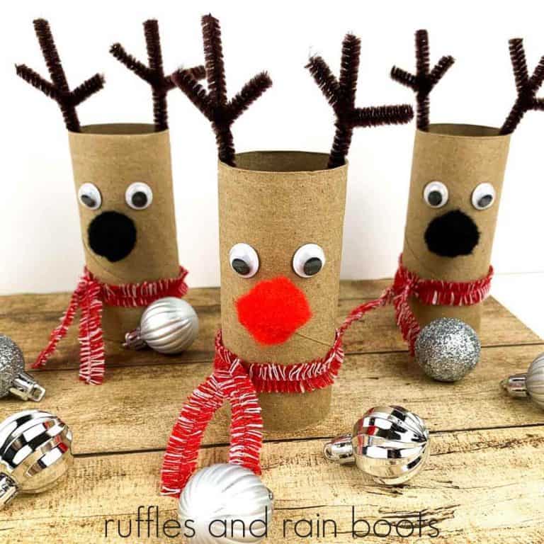 square image of three reindeer paper roll Christmas crafts made with pipe cleaners and pompoms with text which reads ruffles and rain boots