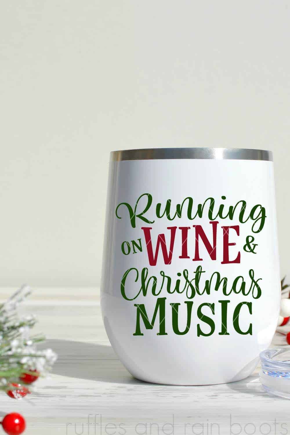 running on wine and christmas music svg from ruffles and rain boots in red and green vinyl on white wine tumbler