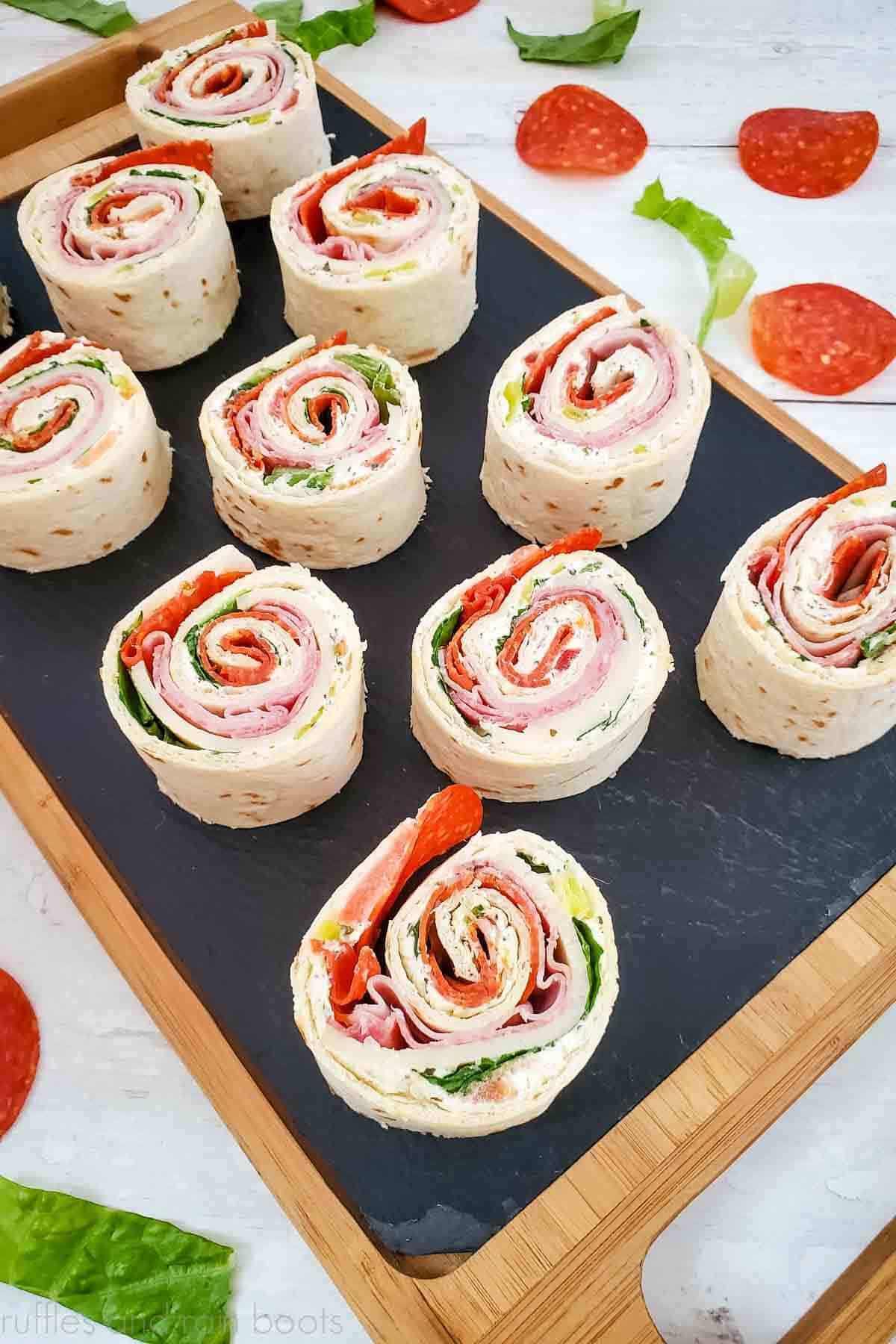 Many pinwheel sandwiches made with Italian meats for a quick lunch idea.