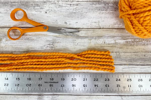 Image showing six lengths of yarn cut to 26 inches.
