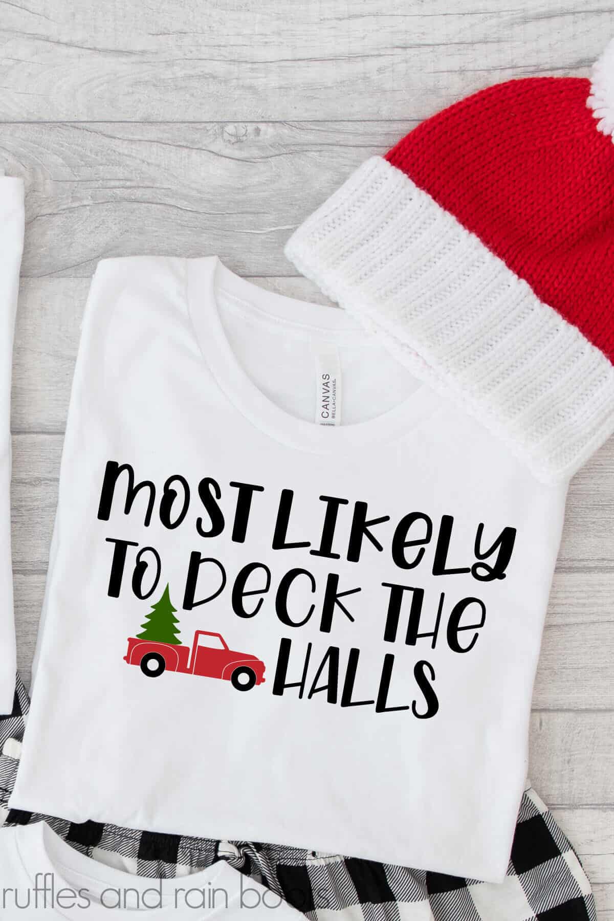 Vertical image of white pajama top with most likely to deck the halls SVG made with a red truck.
