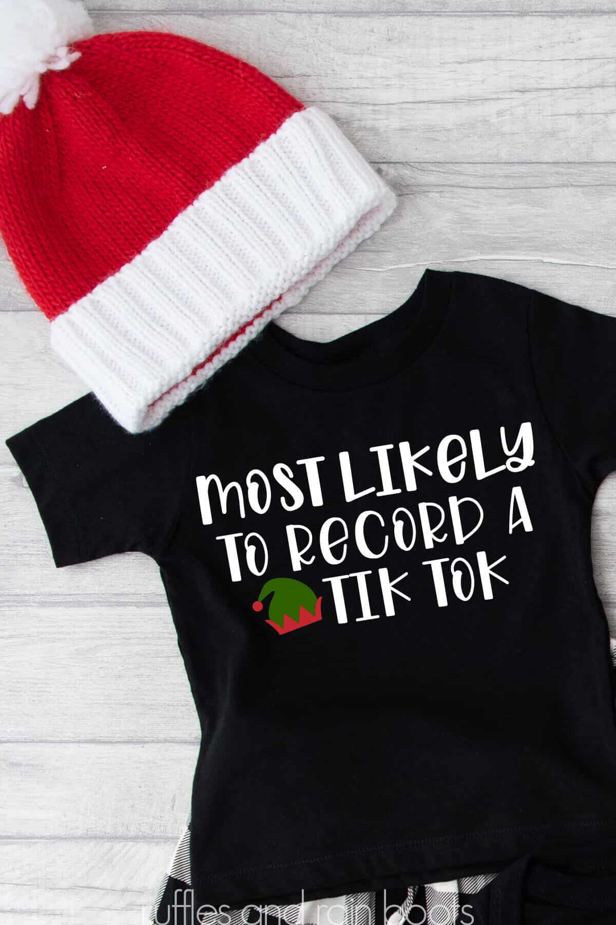 Vertical image of red Christmas beanie and black shirt which reads most likely to record a tikTok SVG.