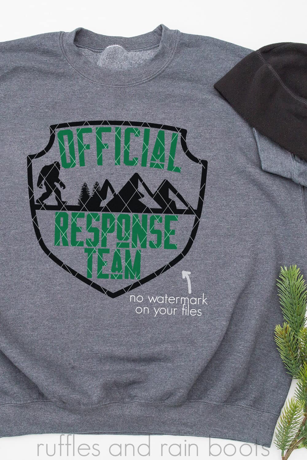 Vertical image of a gray sweatshirt with badge design which reads official response team with sasquatch bigfoot and mountains.