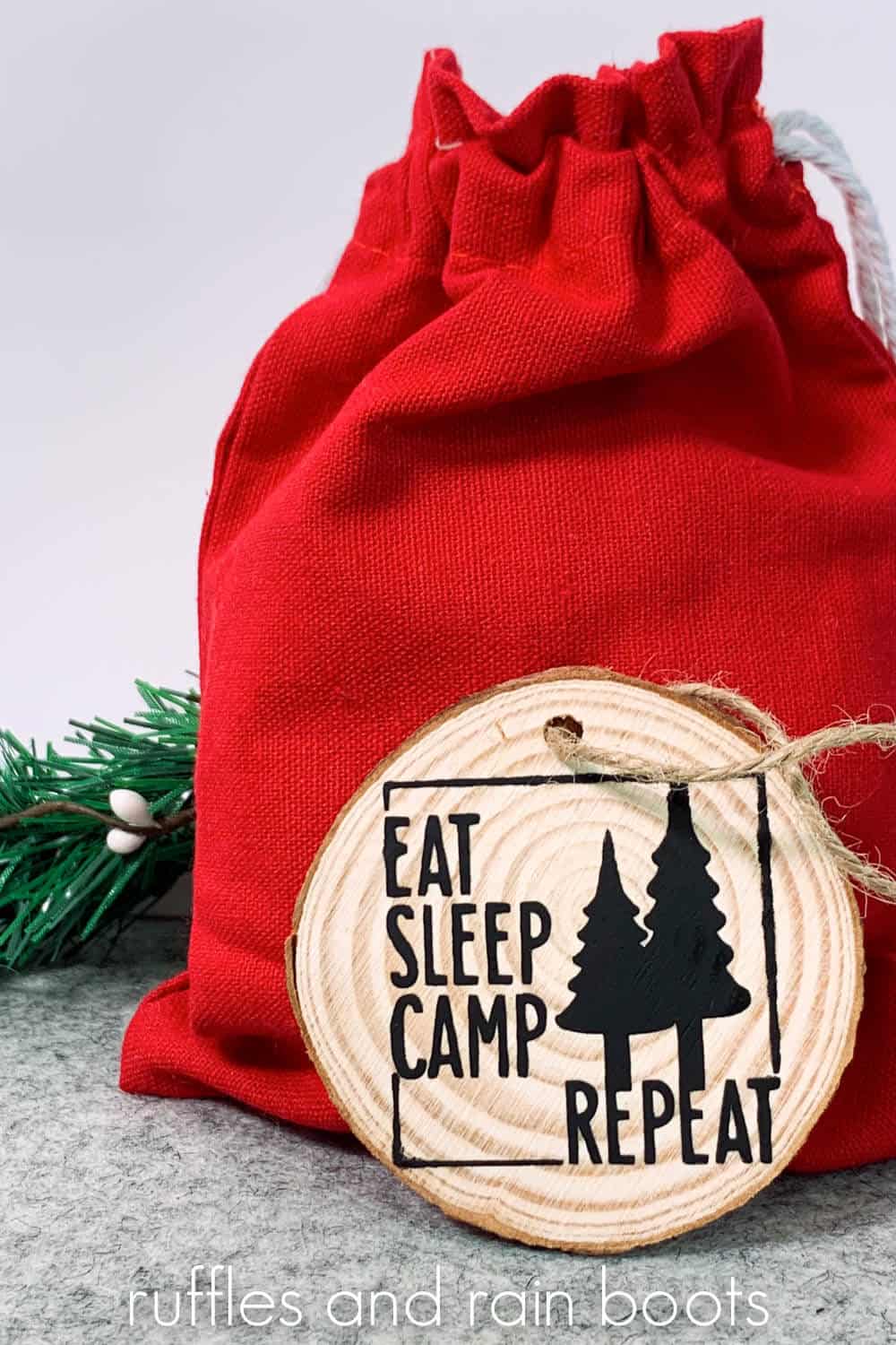Vertical image of Santa sack with eat sleep camp repeat ornament created with free camping SVG.