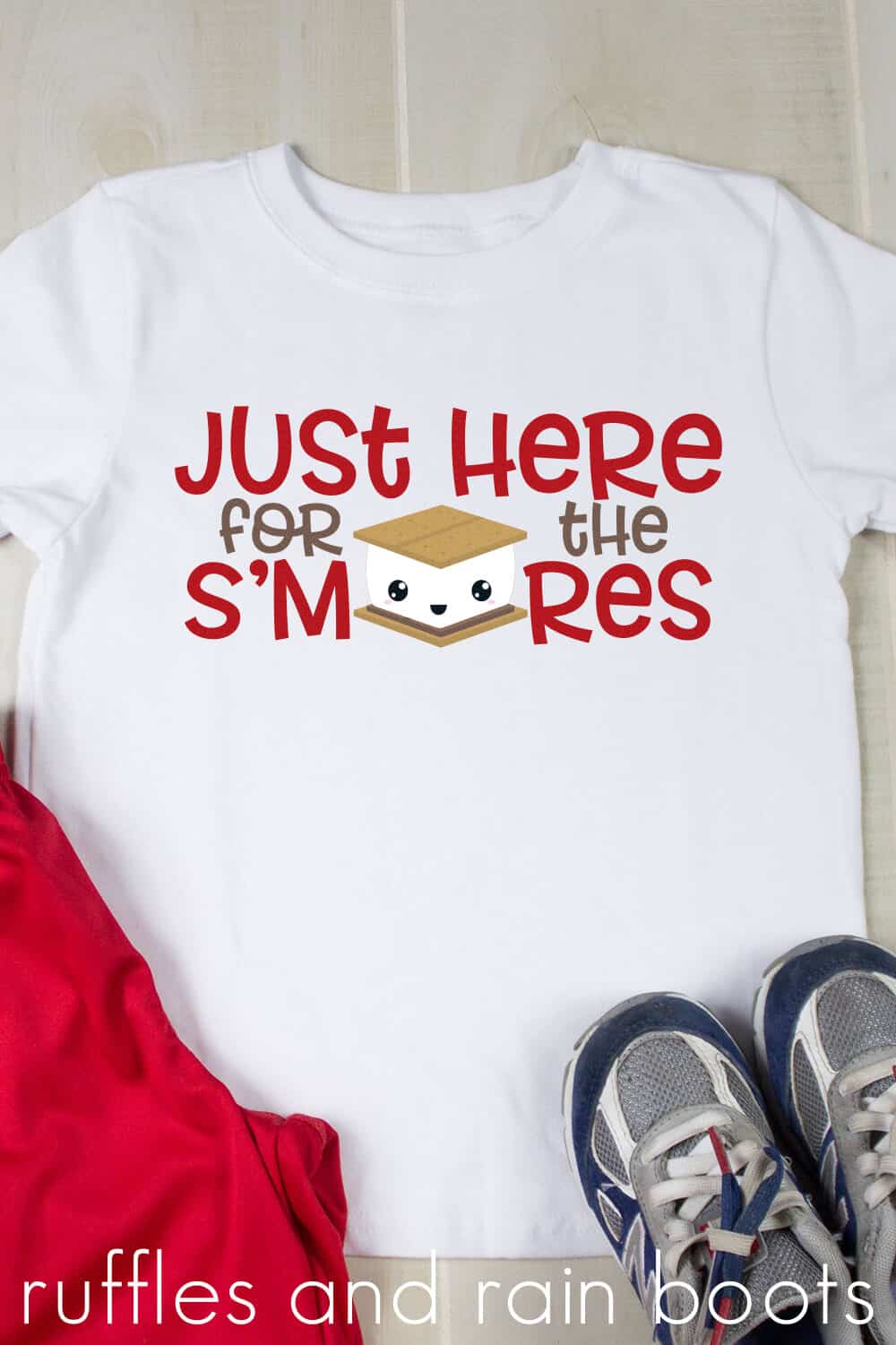 Vertical image of white t-shirt with Just Here for the S'mores SVG created with heat transfer vinyl.