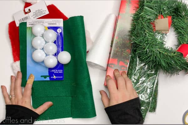 Supplies to create a standing Christmas tree gnome from the Dollar Tree on a white background.