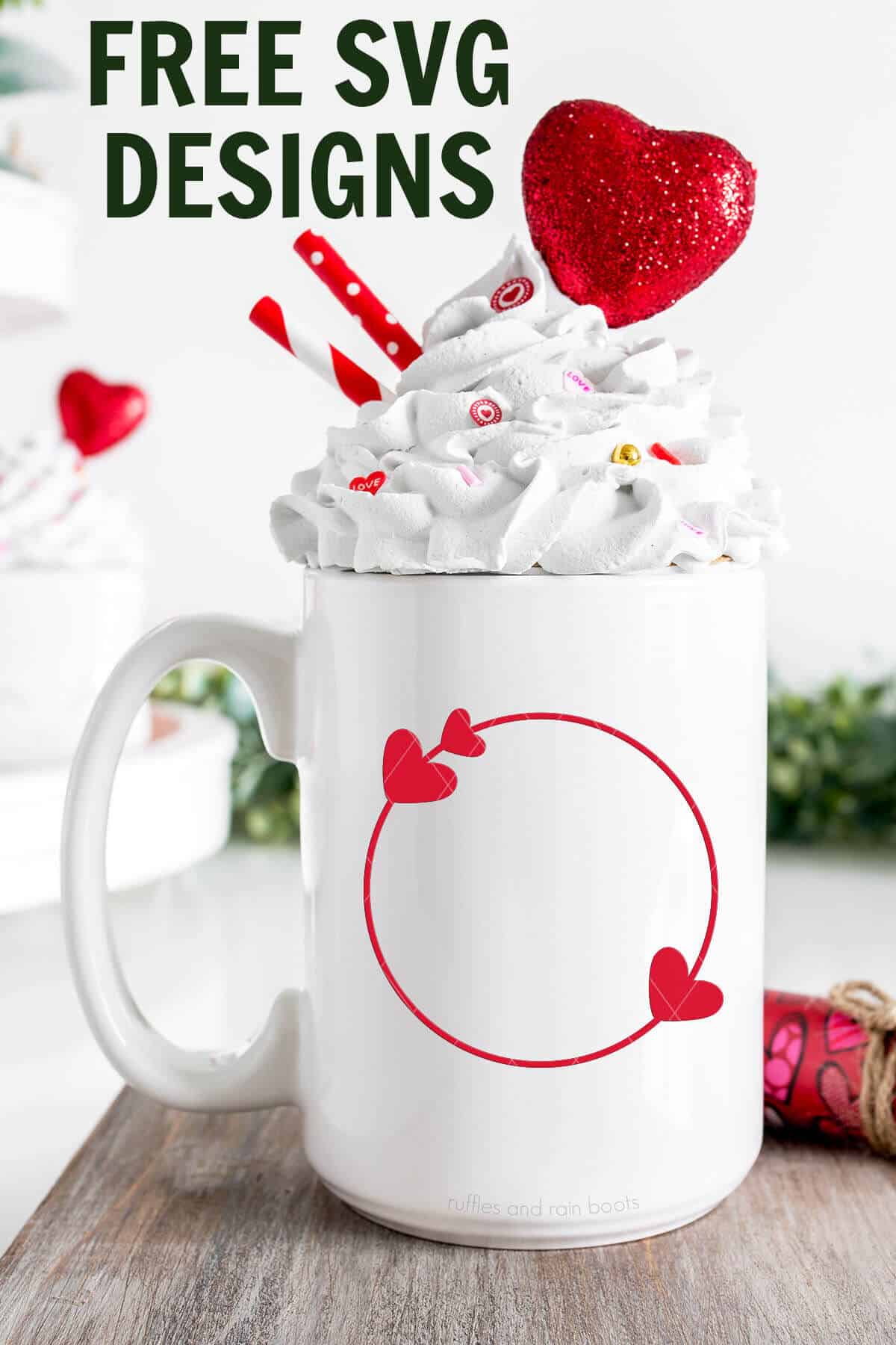 Vertical image of a white mug with whipped cream and red heart frame in vinyl with text which reads free svg designs.