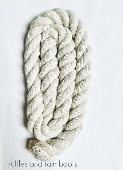 White cotton nautical rope in the shape of a bunny ear on a white surface.