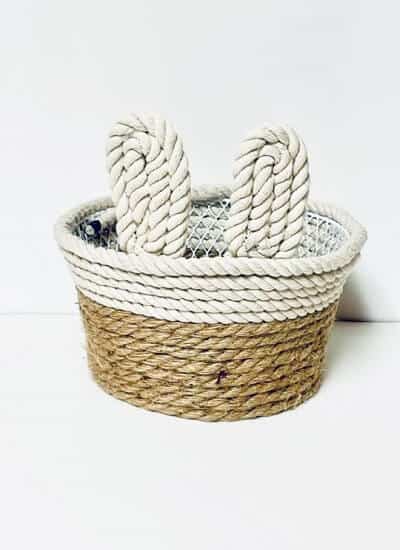 Farmhouse Rope Bunny Basket on a white surface and a white background.