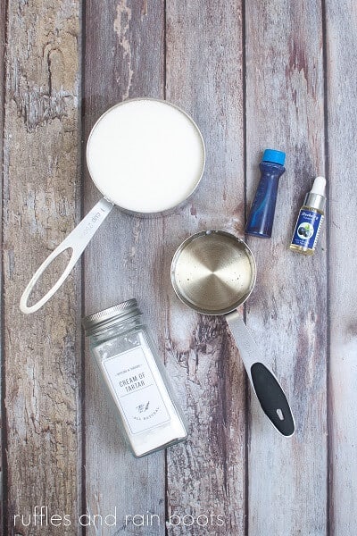 The ingredients for the homemade lollipops on a weathered wood surface.