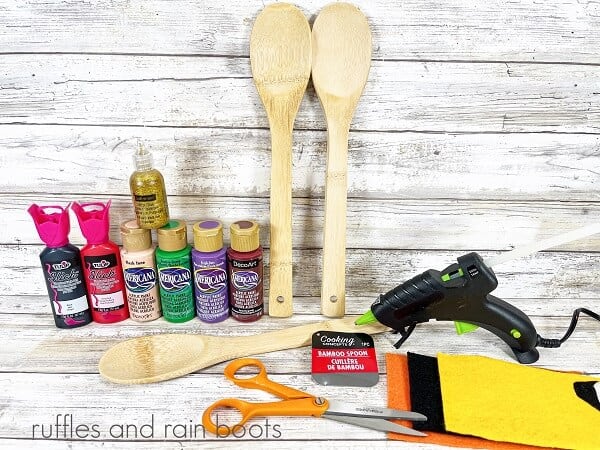 The supplies for the Sanderson sisters wooden spoons craft.