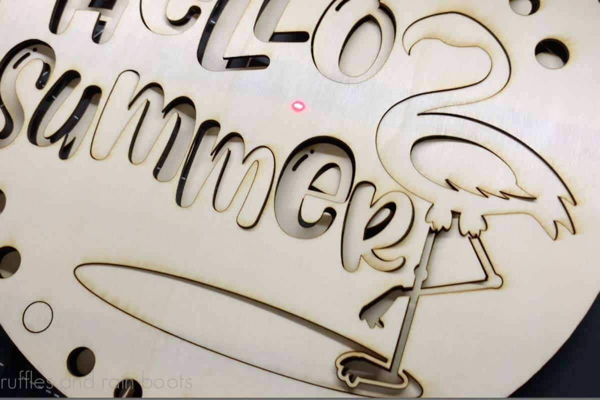 Close up image of cutout wood pieces for a summer door sign made by the xTool M1 laser.