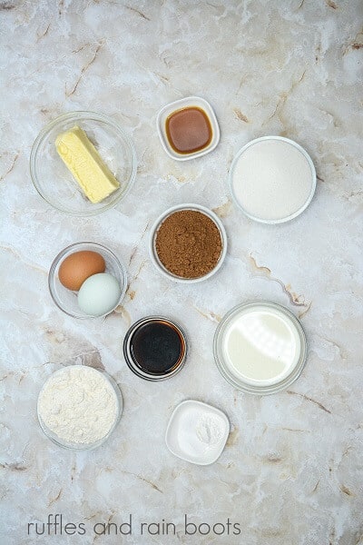 Ingredients for the edible cookie dough cupcakes against a marble background.