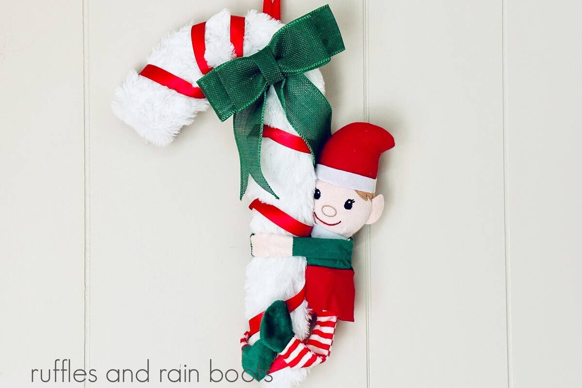 A close up of a DIY Dollar Tree Christmas elf wreath against a white background.