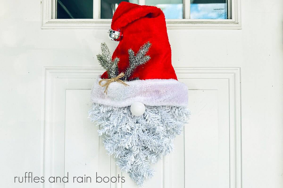 Dollar Tree Christmas Santa Gnome Wreath hanging on a white door with four windows