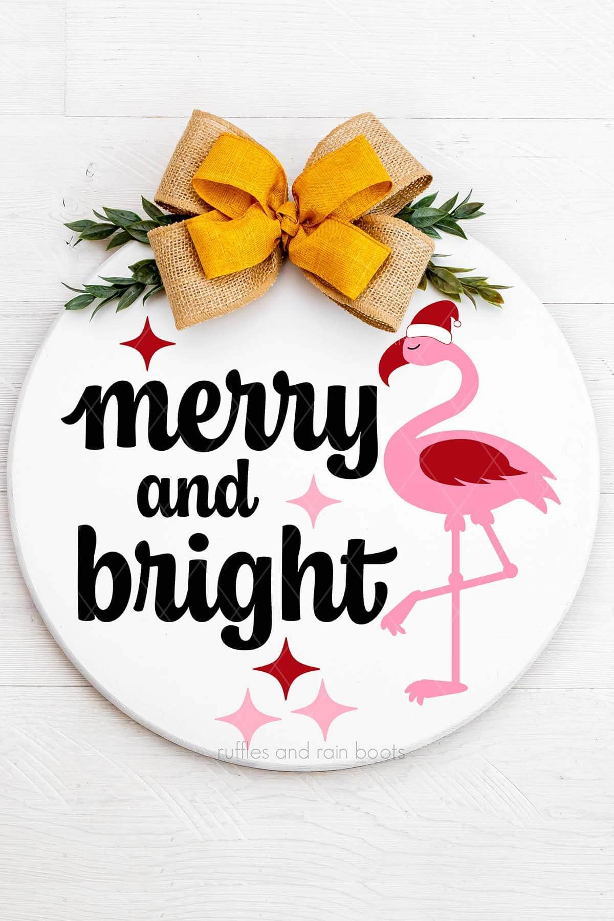 Split vertical image of a white door sign with burlap and yellow bows with pink, red and black permanent vinyl of a flamingo in a Santa hat and merry and bright.