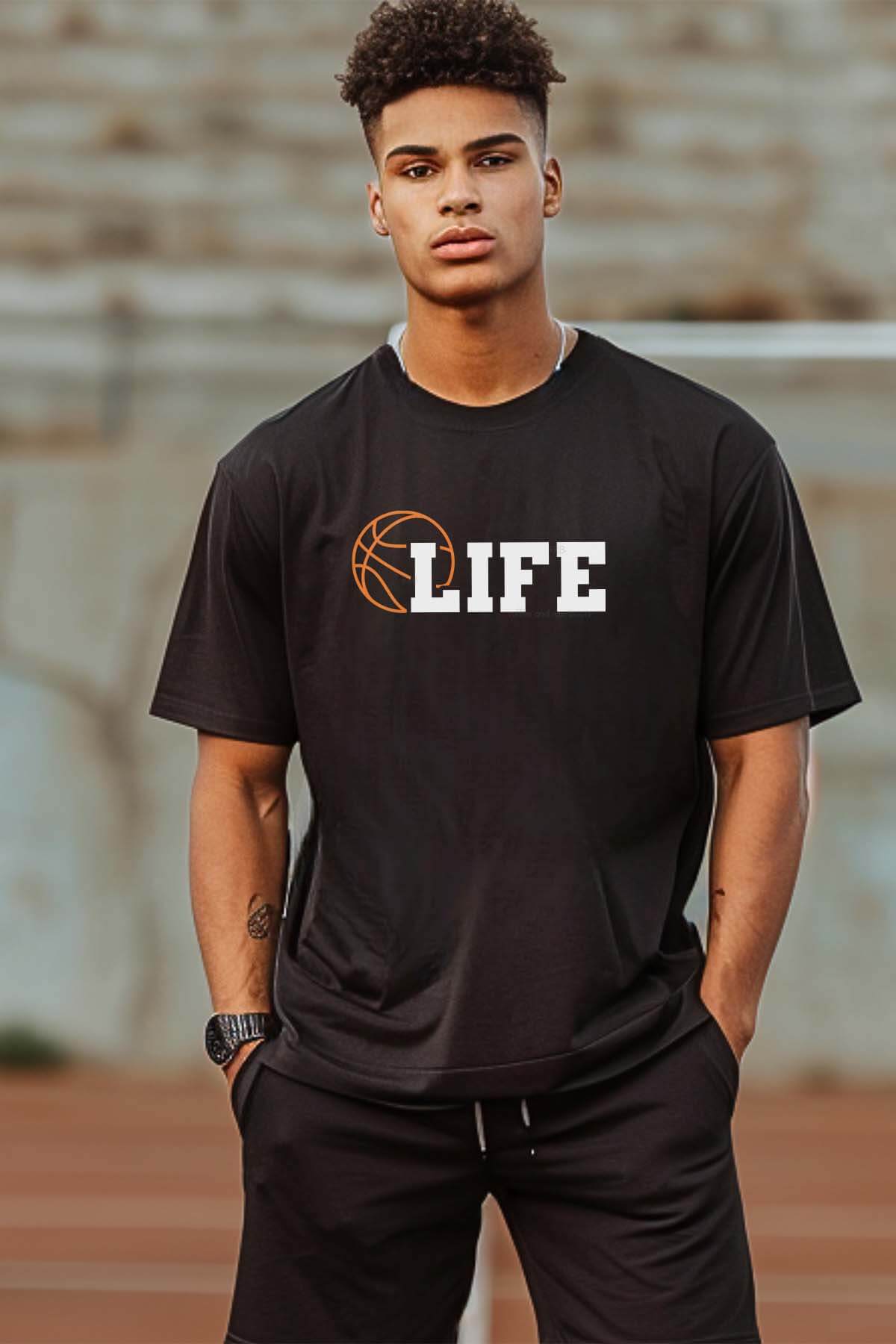 Vertical image of a handsome man in a stadium wearing black pants and t-shirt which reads basketball life.