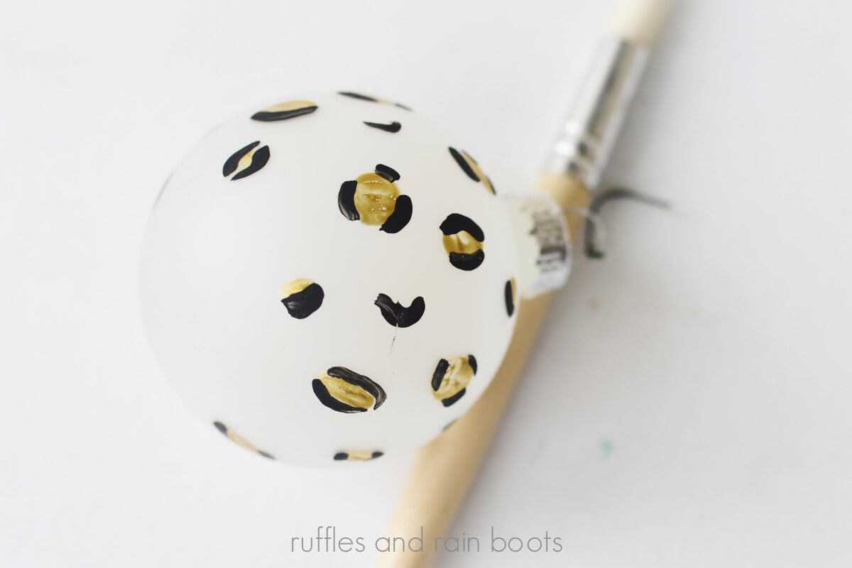 Crafter painted commas on the outside of the acrylic paint ovals to create a fun animal print in a leopard style.