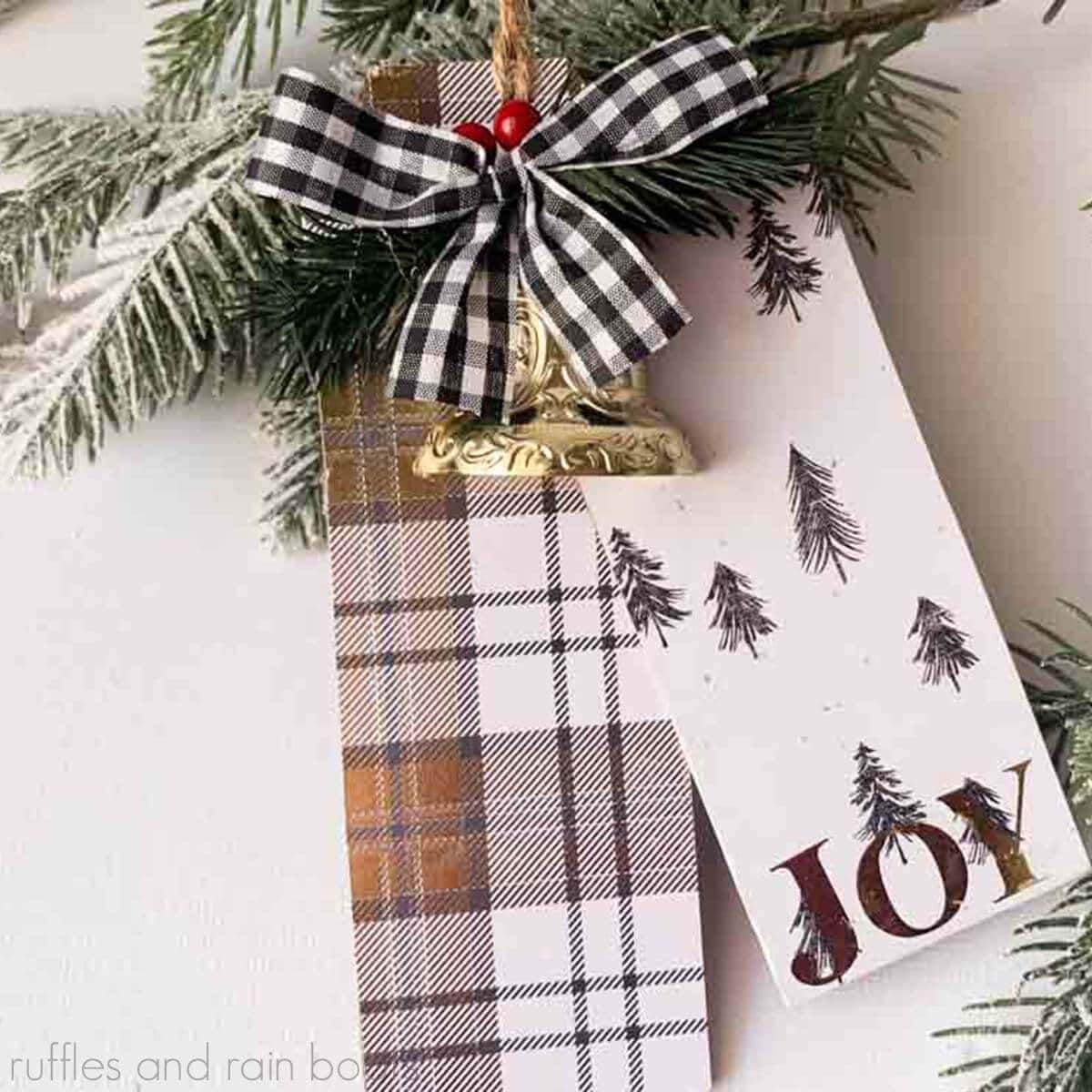 Square, close up image of a gold themed JOY Christmas ornament made from the dollar tree tag ornament.