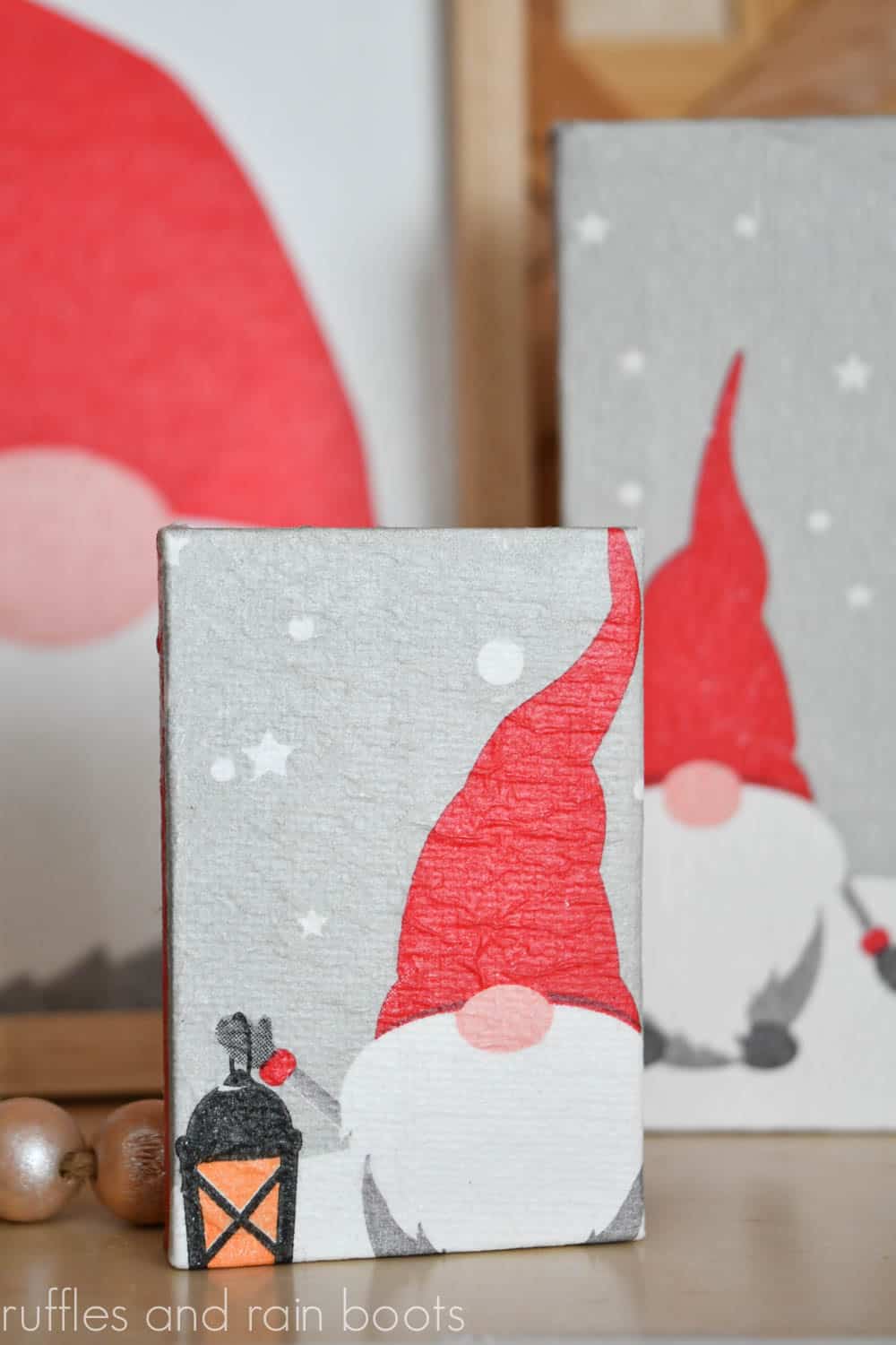 Vertical image of three gnome napkins decoupage onto canvas for holiday decor.