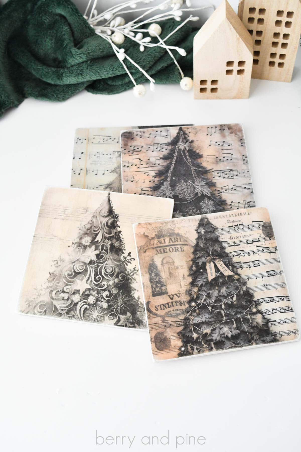 Vertical image of Christmas decoupage coasters made using paper and a decoupage technique.