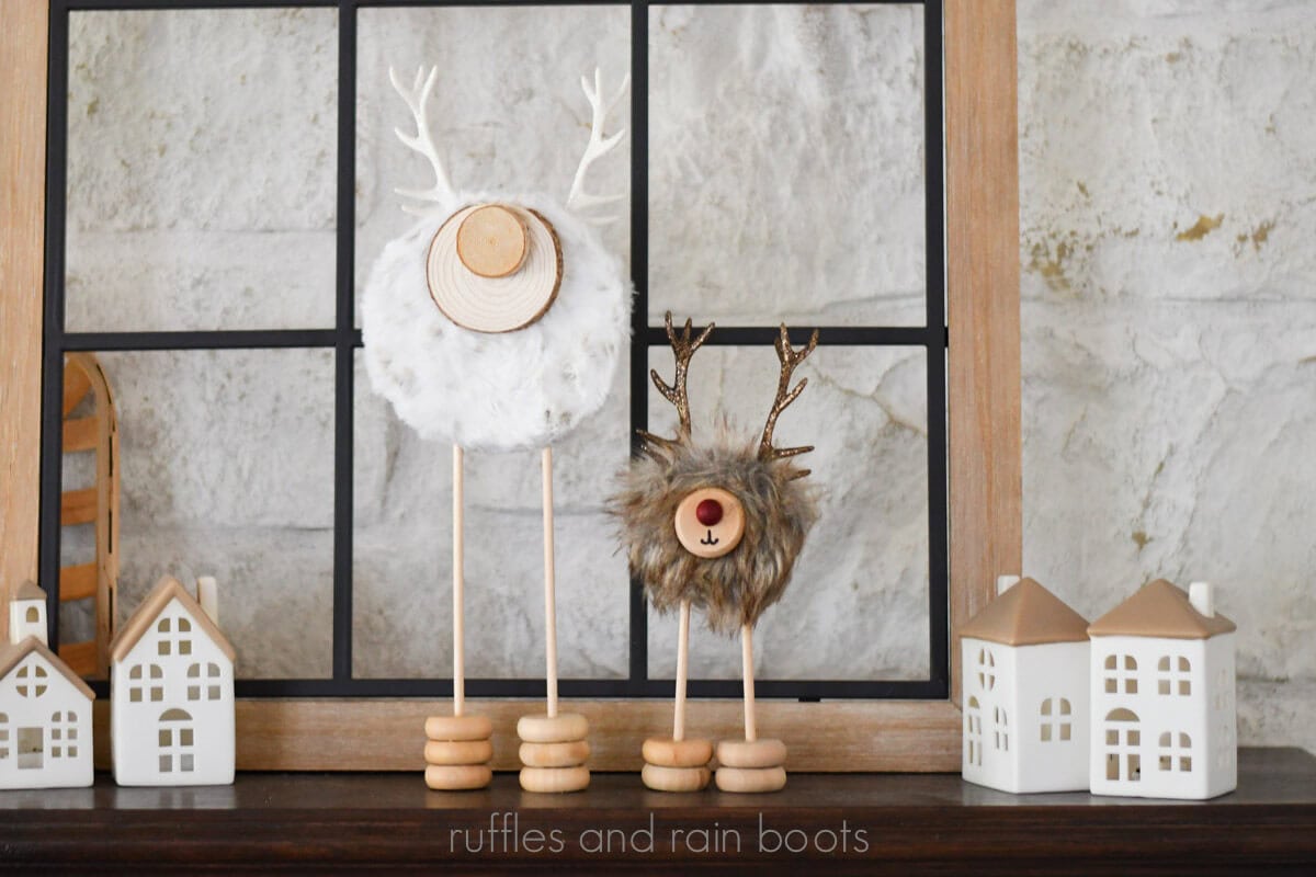 Horizontal image of two standing reindeer made from foam, faux fur, dowels, and wooden wheels.