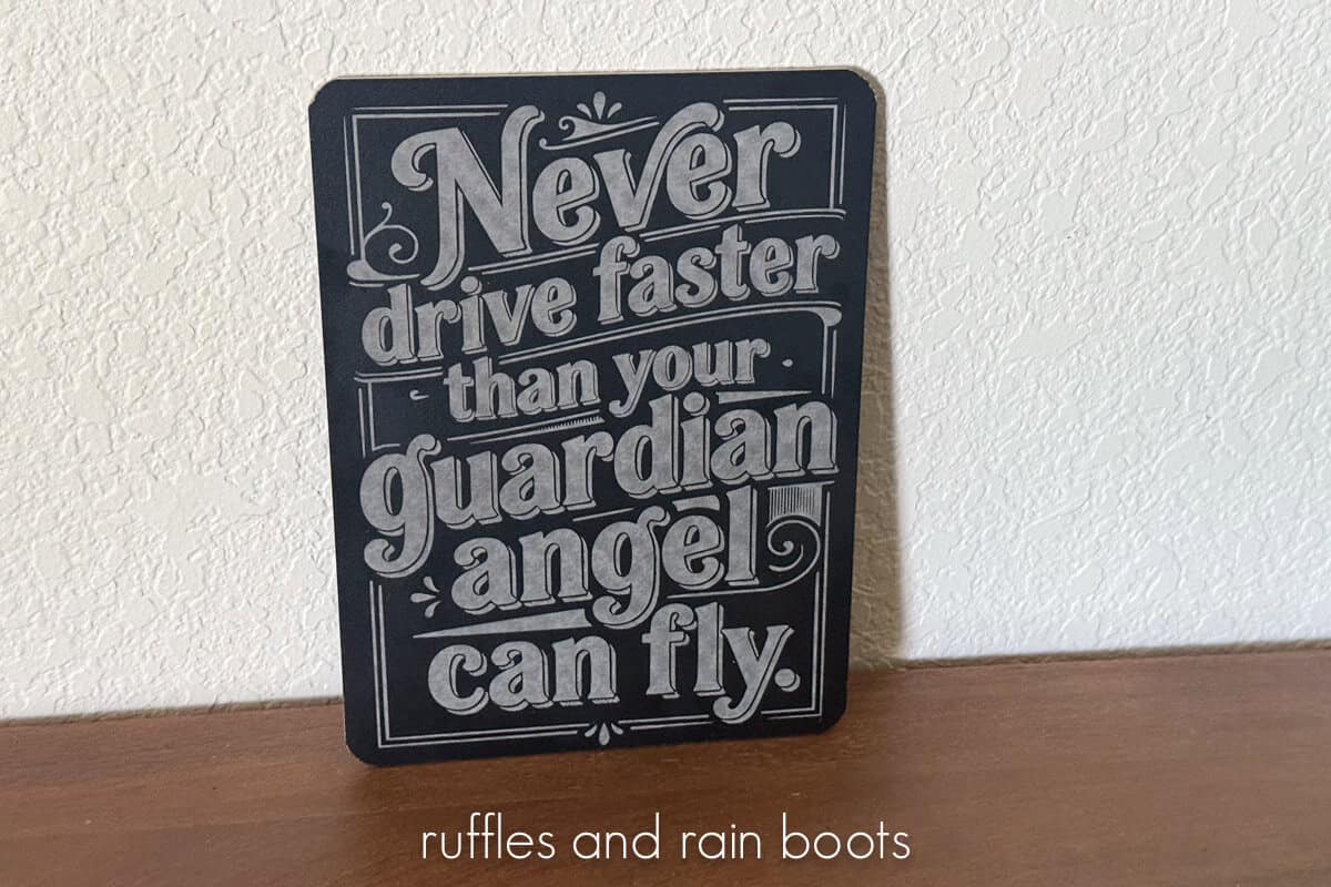 Horizontal image of a laser engraved dollar tree chalkboard which reads never drive faster than your guardian angel can fly.