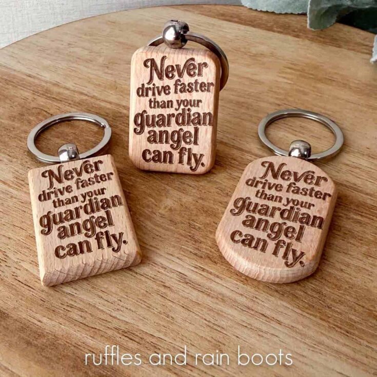 Square close up image of three keychains laser engraved with a funny reminder to drive safely.