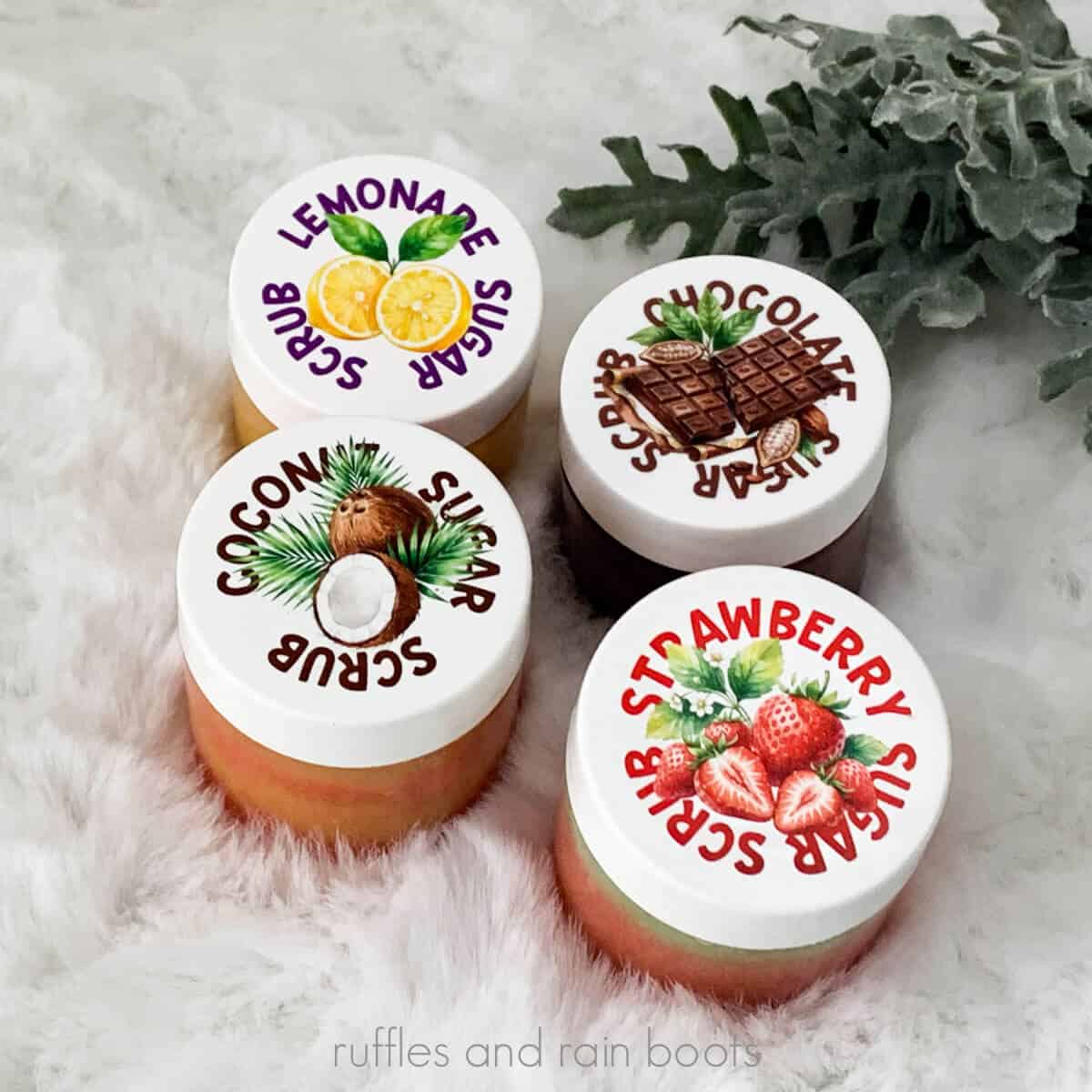 Square image of four sugar scrub recipes in different colors in jars with custom artwork labels created by Ruffles and Rain Boots.