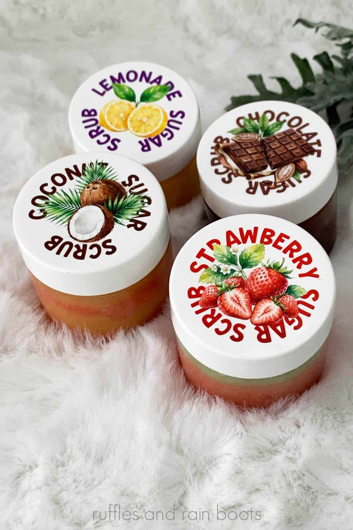 Vertical close up image of four jarred sugar scrub recipes in lemonade, chocolate, coconut, and strawberry on a white background.