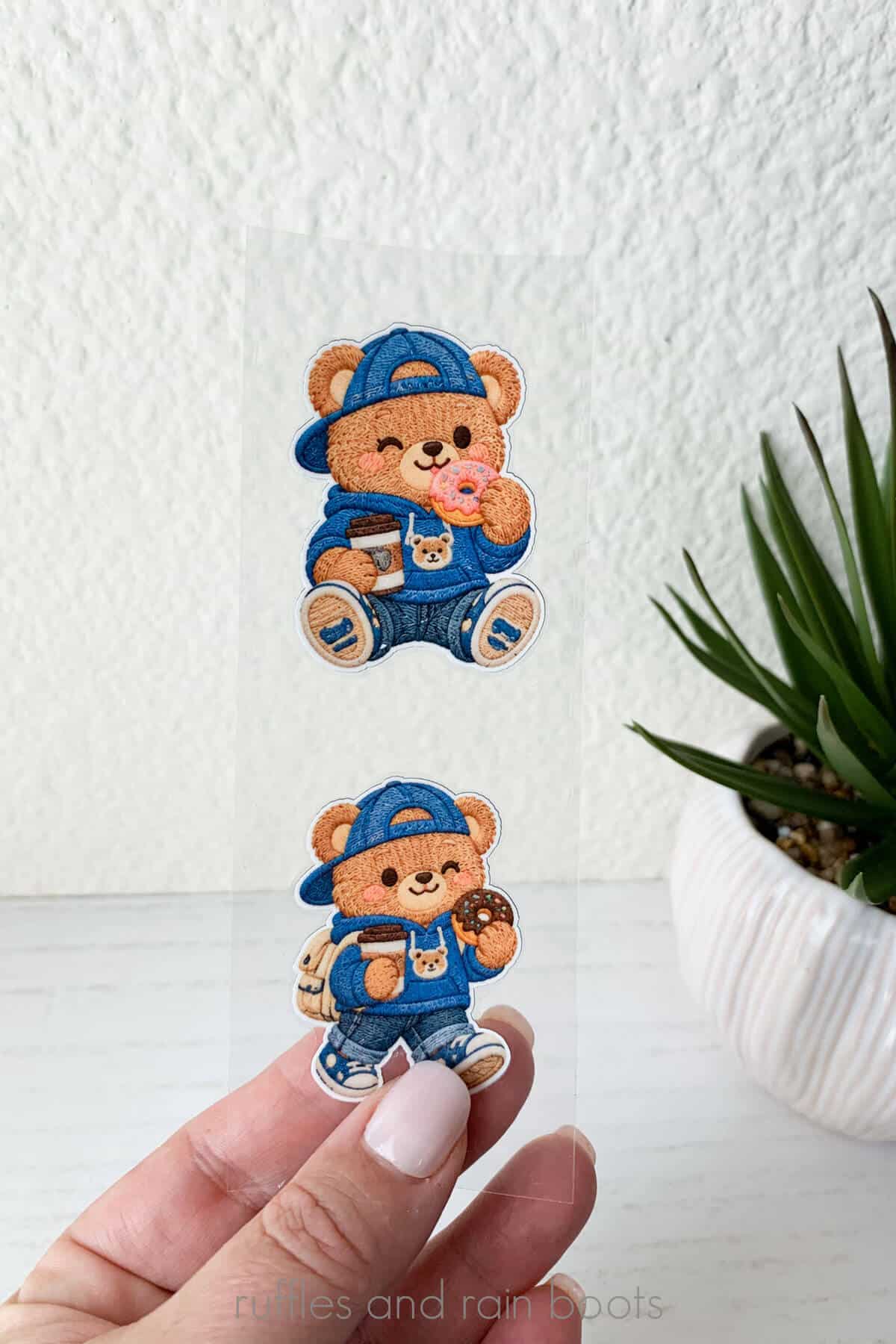 Vertical image of a woman holding textured bear UV printed stickers.