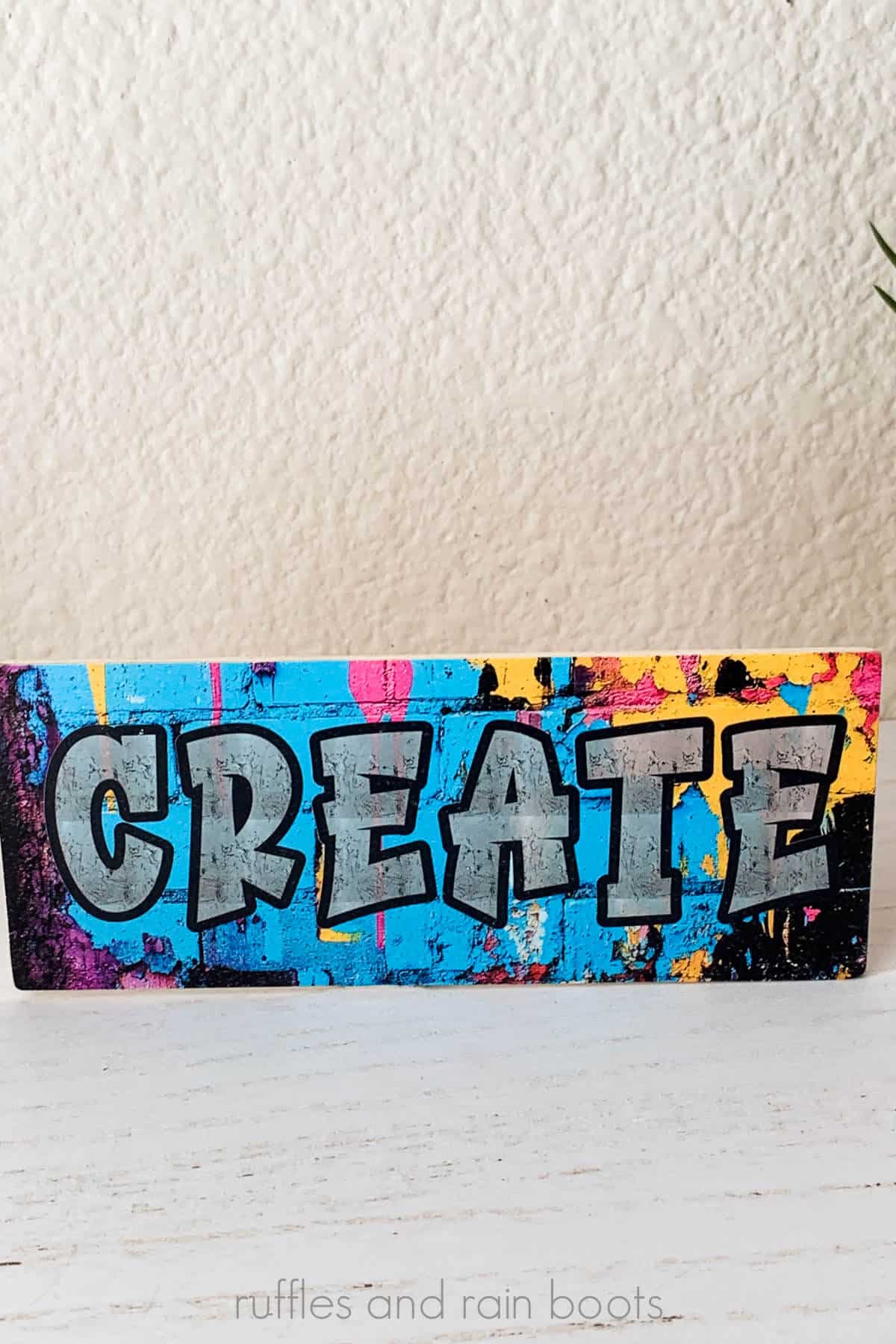 Vertical image of a texture, transparency, and mixed color print of a wood plank made with vibrant and dark colors on the xTool O1 UV printer.